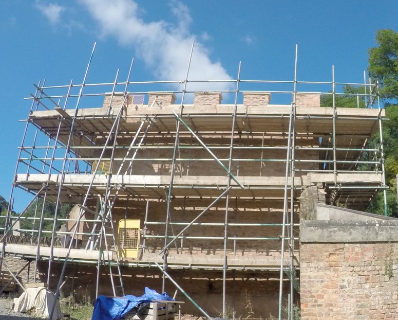 The battlements and east wall being renewed. (Courtesy of Architectural Thread)