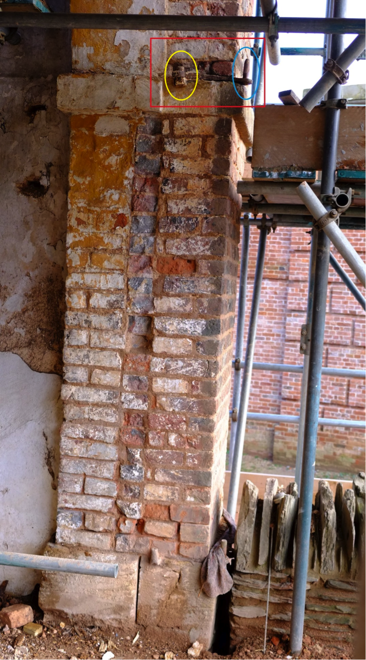 The hinge circled in yellow is the original, in its original eighteenth-century position. The later hinge circled in blue is from the nineteenth-century hanging of the doors, outside the archway instead of within it as originally intended. 