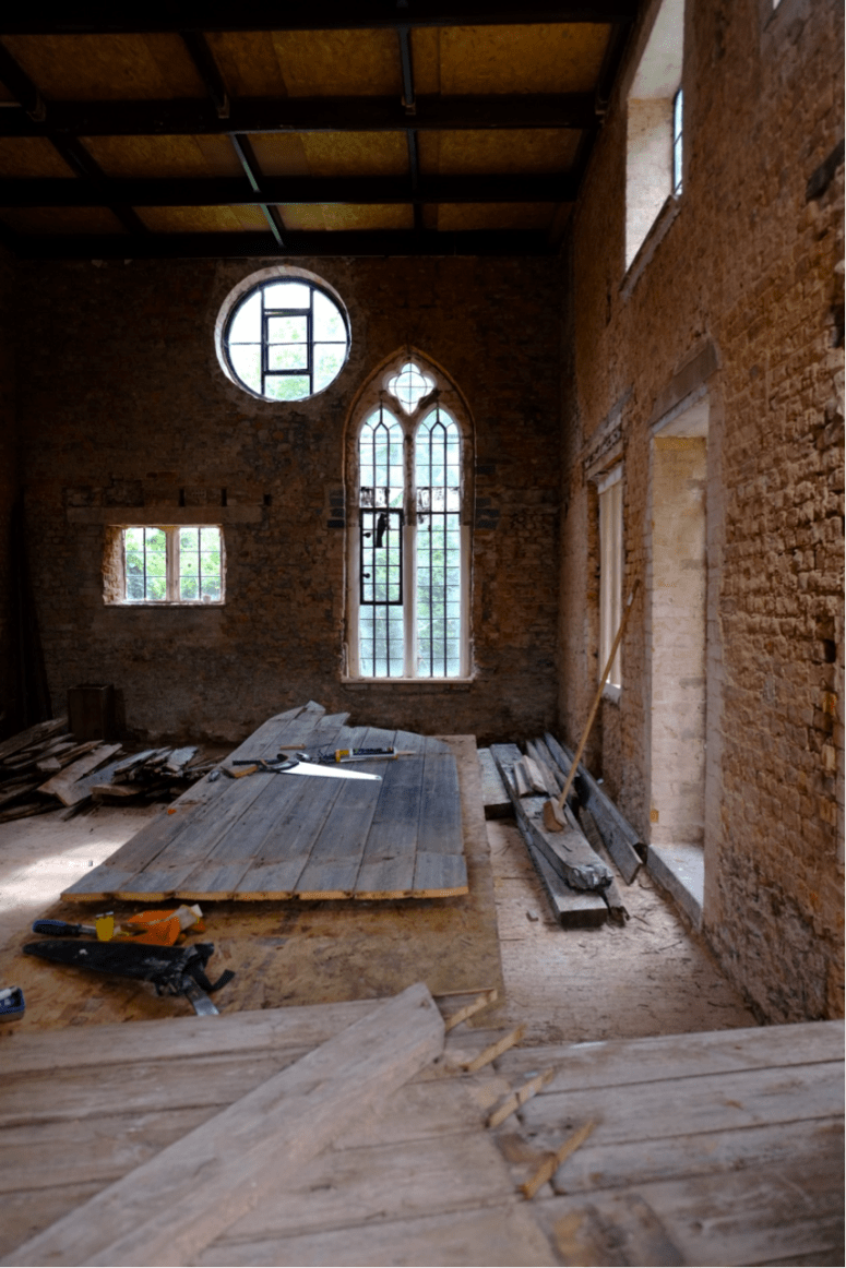 The estate workshop with Corbel Conservation working on the old and new doors to the Coach House. (Courtesy of Architectural Thread)