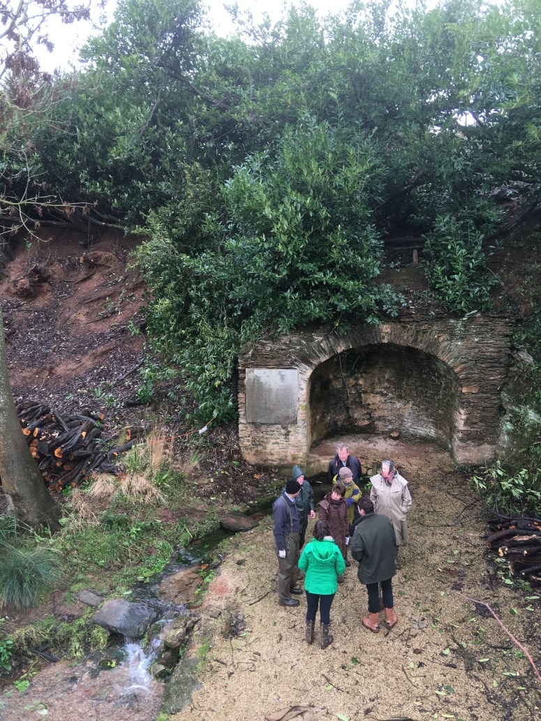 Inspecting the trimming of the laurels at the Grotto and Cold Bath. The Roman Bath-style grotto arches have had the full force of thick laurel roots burying into their structures so a careful removal of the worst offenders was needed to secure the structures. Laurel is believed to have always been the plant of choice around this area to give it a canopy of natural wild overgrowth appropriate to the rather pagan elements of the river source and the surrounding follies.