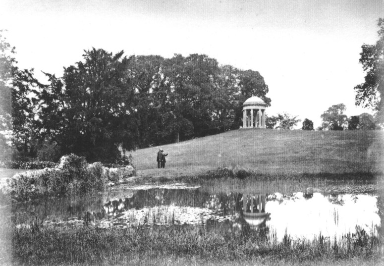The rusticated stone bridge on top of the Grotto, photographed from the north lawn in the 1890’s. Water from the pond would appear to flow under this bridge on the left (obscured by foliage), but by 1771 this water cascade was removed and subterranean pipework fitted to take the overflow of water away invisibly and down to the ponds near the gate lodge. 